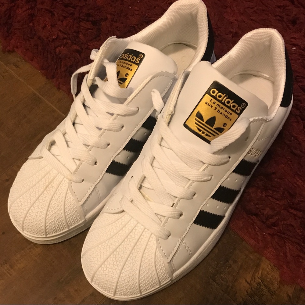 Black and white adidas superstar